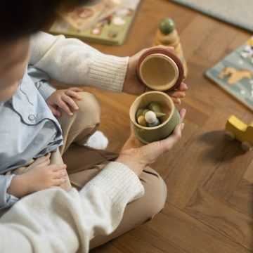close-up-parent-kid-with-toy
