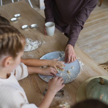 woman-helping-kids-cook-high-angle